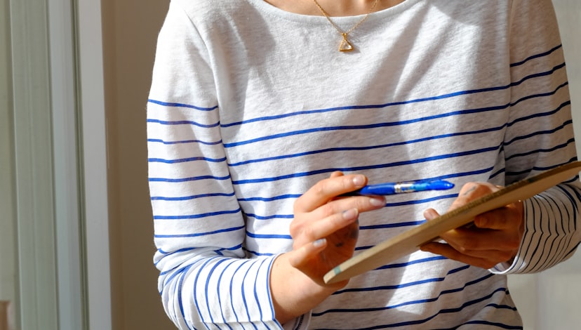 Inspecting a property and recording notes on a clipboard