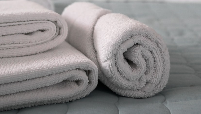 Folded fresh white towels and linen